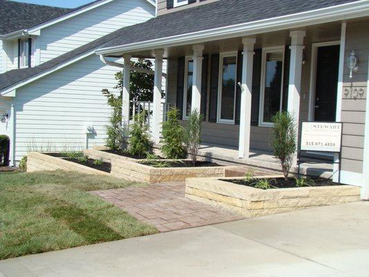 Limestone Retaining Walls and Plantings by Stewart Landscapes, Inc. Johnston, Iowa