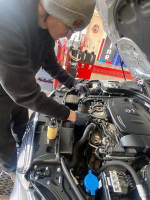 One of our Technicians replacing the oil filter on a Mercedes Benz