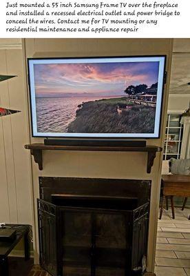 Tv mounted over fireplace