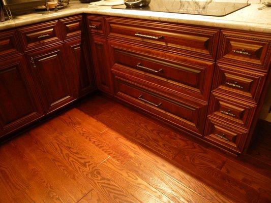 lower dark wood cabinets on the floor level