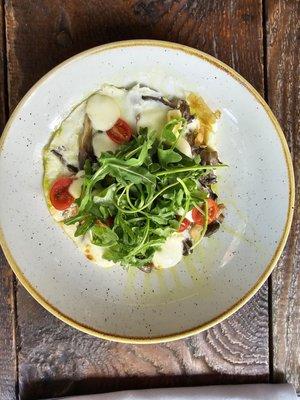 Egg white frittata with arugula and cherry tomatoes.