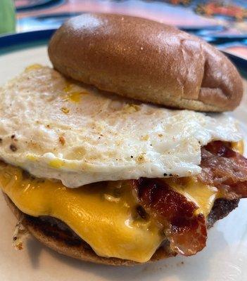 "Matty Burger " with a fried egg, bacon, American cheese and an angus beef patty on a brioche bun.