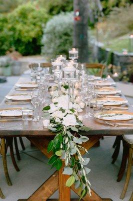 Dinner reception florals and floating candles by Be Buds Florist