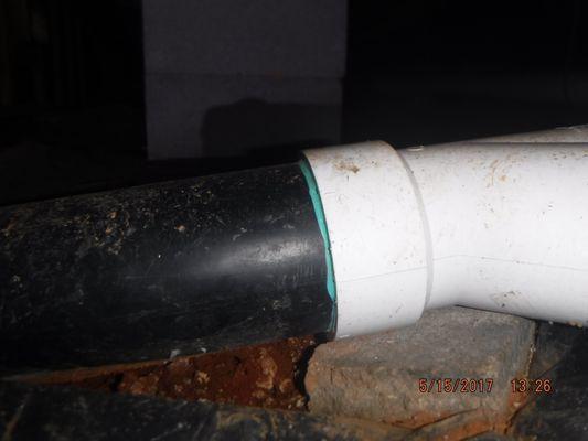 ABC and PVC plastic drain pipes cement welded together is not a recommended joint.