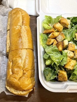 Garlic bread and Caesar salad on right