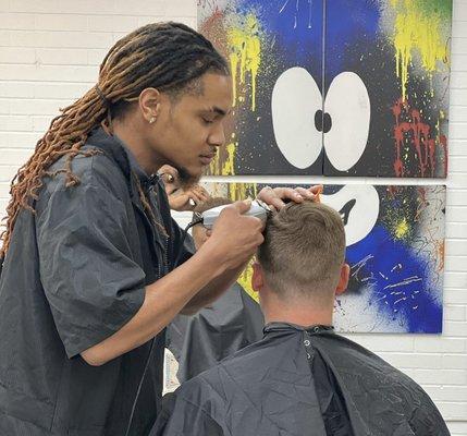 Reviving style with a touch of modern flair at No Grease! Unlimited barbershop.