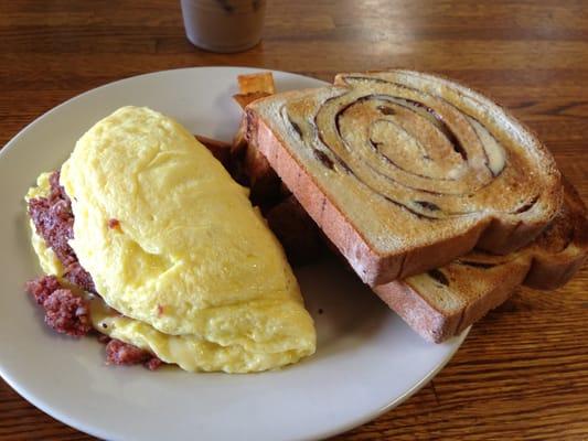 Boston (homemade hash and cheddar) omelette, home fries, and homemade cinnamon raisin toast.