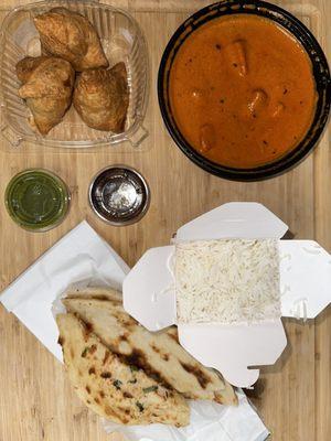 Chicken tikka masala, veggie samosas, basmati rice and garlic naan.