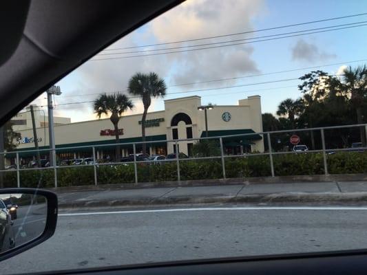 Starbucks just yards before the entrance to the Florida Turnpike off Glades Road, you can pull in for a drink before you get on.