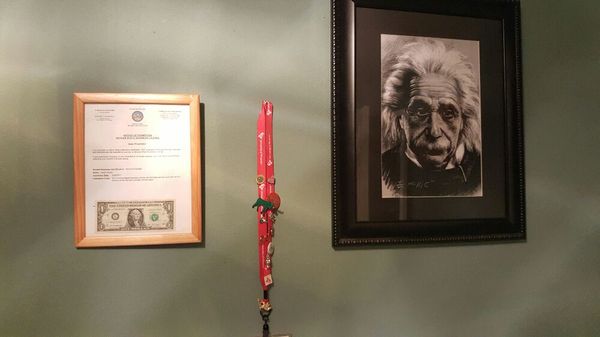 My brag wall. Business license and Einstein is someone who I have always admired.