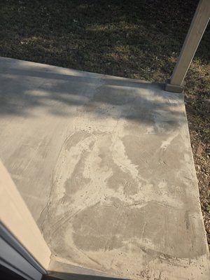 Back porch after resurfacing. You can see where the contractor ran out of material and ditched the rest of the job.