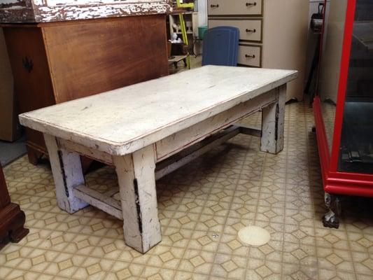 Troy Wesnidge custom-design table. Includes drawer. Distressed style.