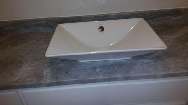 Carrera marble and vessel sink