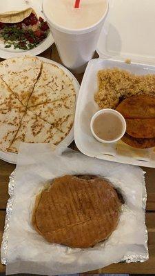 Beef fajita torta, chicken quesadilla more, al pastor taco, horchata, and quesabirria plate.