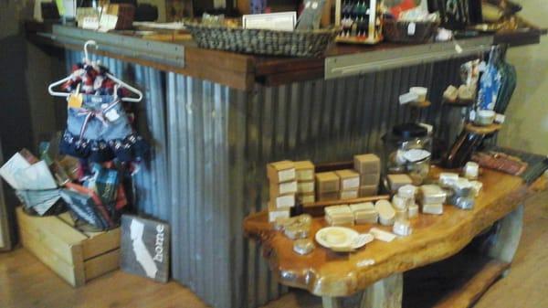 The view of the counter at an angle: handmade/homemade beauty products, accessories, decor, etc.