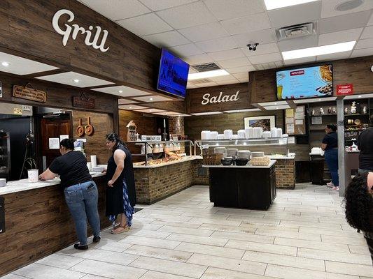 View of all three AYCE areas: grill, sides and salads.