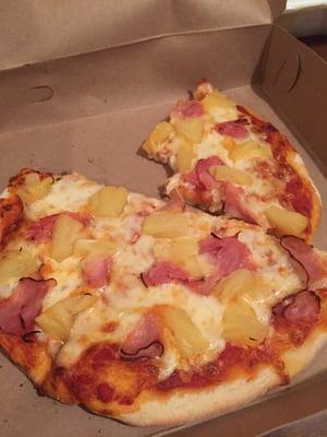 Personal cheese pizza with ham and pineapple toppings!