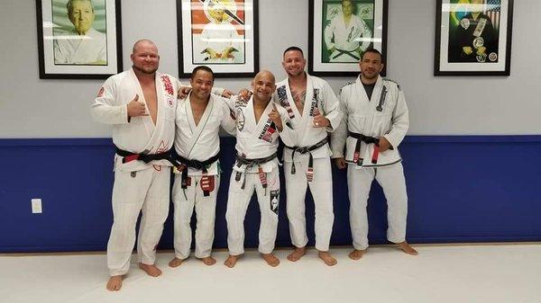 Black belts on the mat...