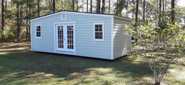 12 x 24 side gable shed with LP Smart Lap siding and custom paint. HOA approved shed.