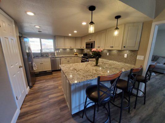 Beautiful kitchen designed by Sydnee at the Roseville store. Cabinets, countertop and flooring