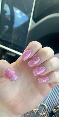 acrylic nails with a sparkly pink polish