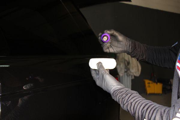 Pictured here is our technician applying our Platinum Ceramic Coating package to a 2022 Range Rover HSE. This package offers superior finish