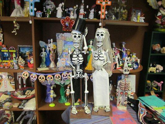 Large selection of Mexican Day of the Dead folk art.  Papel picado, sugar skull molds, many different Catrinas and much more.