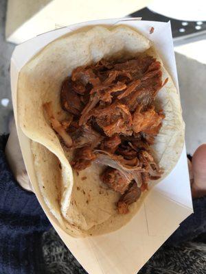 Carnita Taco (shown without onions and cilantro). $1.75 as of January 2018