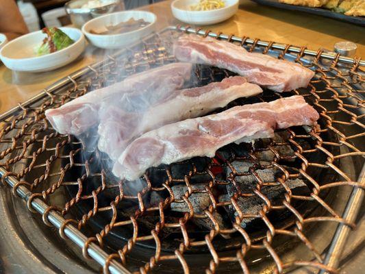 Pork belly being cooked