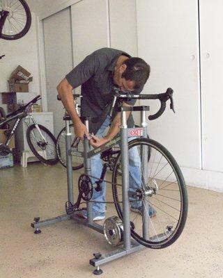 Mike setting up the portable bike fitting rig in my garage