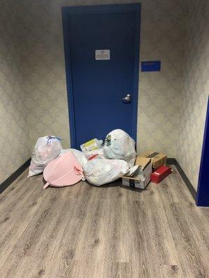 trash bags accumulating outside the trash room (residents never fined)