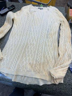 Front of ladies cashmere sweater stained by David's Drycleaning