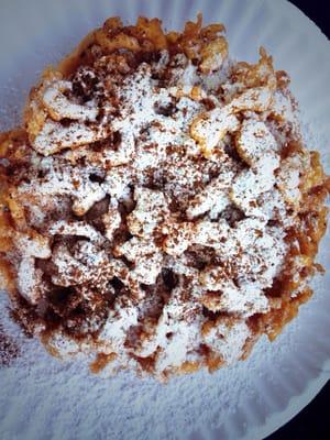 Pumpkin Spice Funnel Cake  - Homemade pumpkin batter, sprinkled with powered sugar, then topped off with a hint of cinnamon