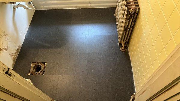 Small bathroom floor installation with waterproof LVP flooring!