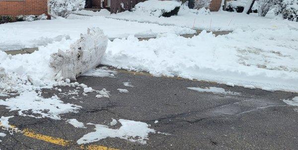 Front of parking space piled with snow by Cmark 2/23