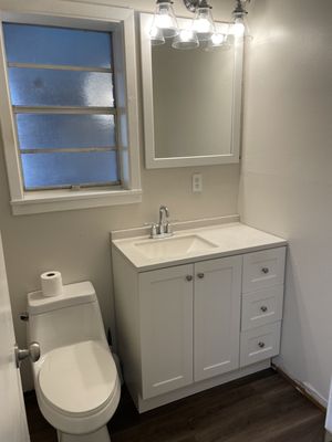 Toilet and vanity that had to be put back after tub install