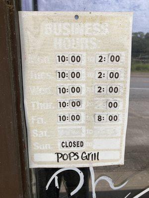 restaurant hours posted near front door