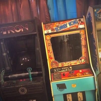 A few classic arcade games in the corner