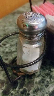 Rusty, dirty, clogged salt shaker.