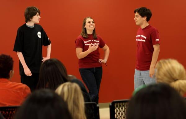 Noah, Alexia, and David entertain the crowd before the community improv workshop