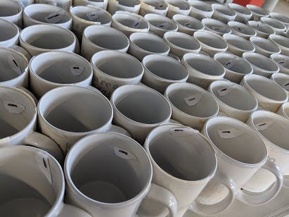 Lots and lots of mugs! We custom produce 10,000+ mugs a month.