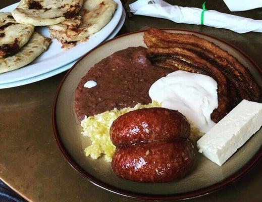 L: chicharrón con queso (pork n cheese pupusas) R: salvadorean style breakfast (fried beans, eggs, cream, hard cheese n chorizo)