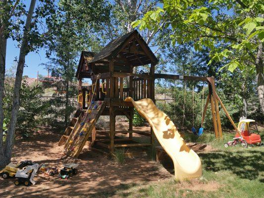 Playground for kids in fully fenced backyard