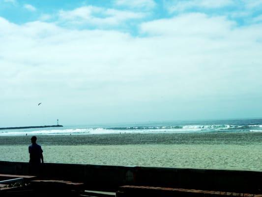 View of Pacific Ocean & South Mission Beach Boardwalk while sitting on the OBO patio