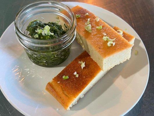 fermented lentil bread served with pistachio pesto