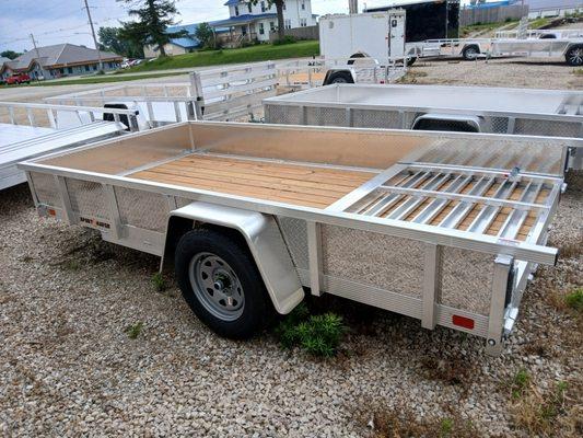 Aluminum trailer with wood deck and sides.