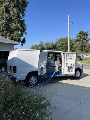 Carpet cleaning van with working equipment.