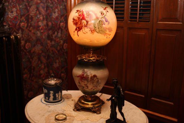 Vintage oil lamp retrofitted to allow for electrical use