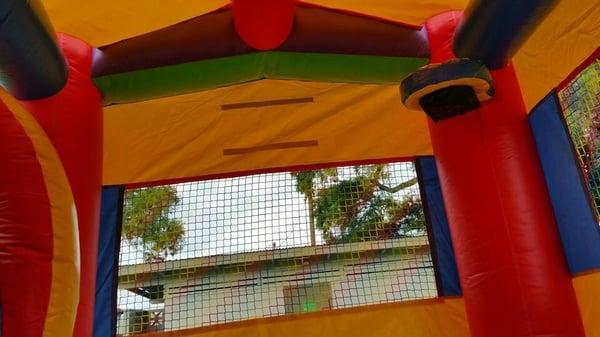 Unique Jumpers Maui LLC 
Ultimate Bouncehouse/Waterslide Combo 
 -Inside view w/Allstar Basketball Hoop