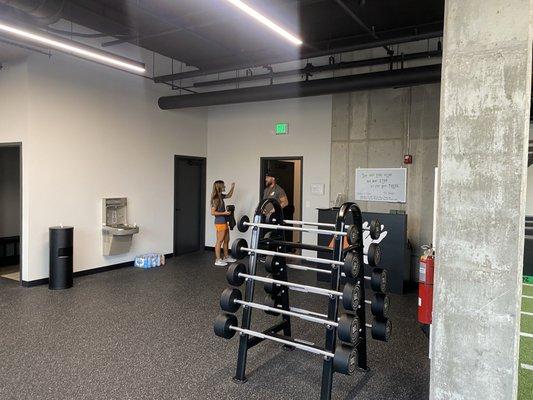 Tuesday, 18 June 2024 -- inside 4 Quarters Fitness studio (Jackson Junker, the owner, and his wife in the background)